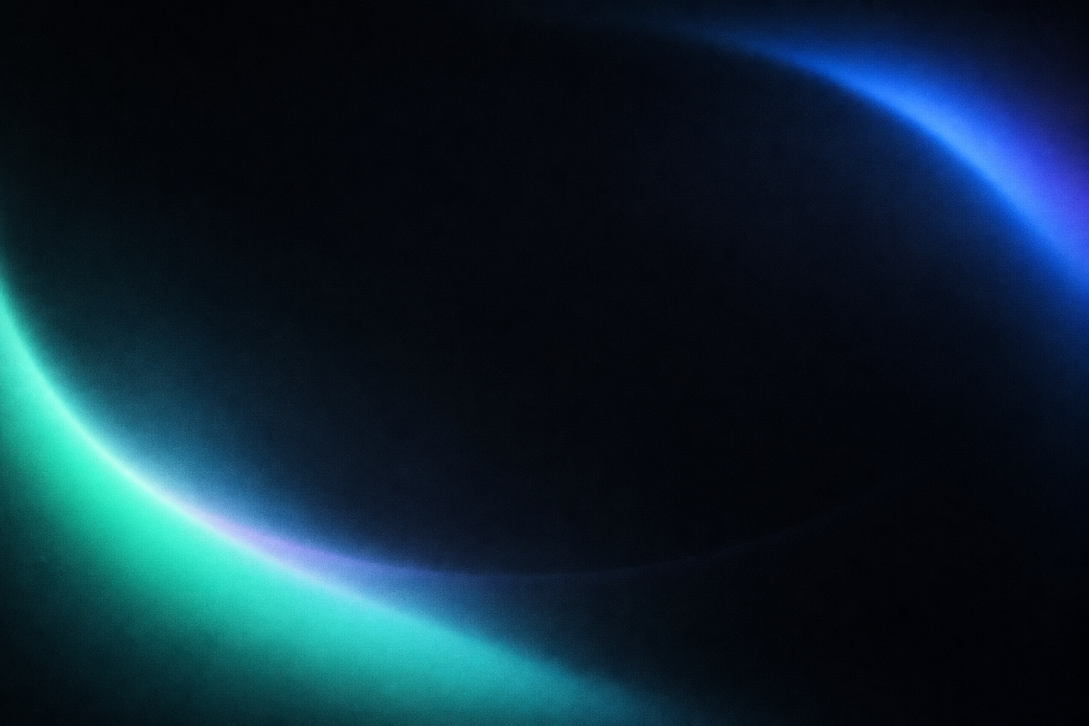 Soft mint and blue light surrounding a dark center