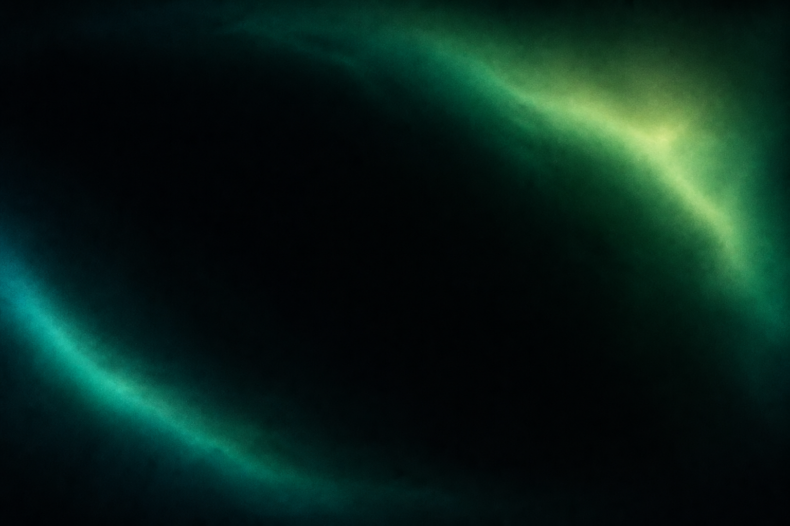 Soft emerald light surrounding a dark center